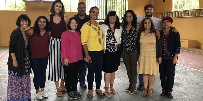 A group of activists and advocates standing in a row in Puerto Rico.