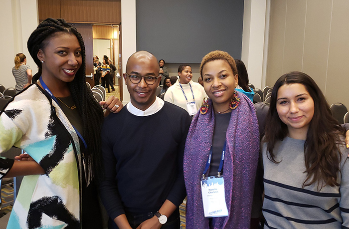 Three Free Press staffers and a Free Press consultant at the Facing Race conference.