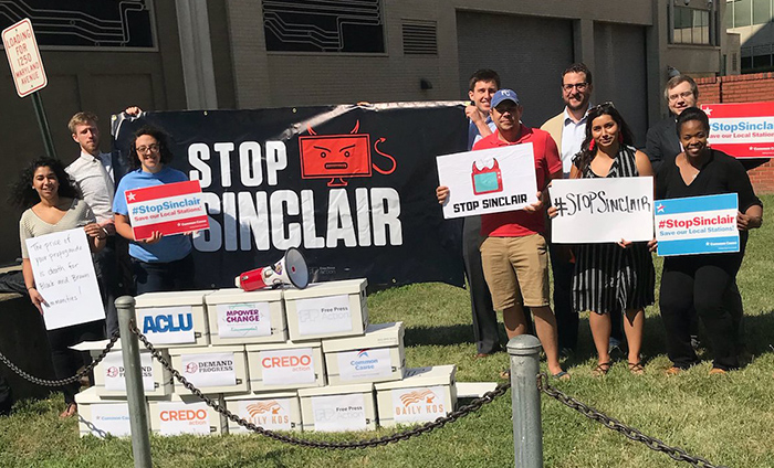 Anti-merger advocates speak out against Sinclair outside the company's headquarters.