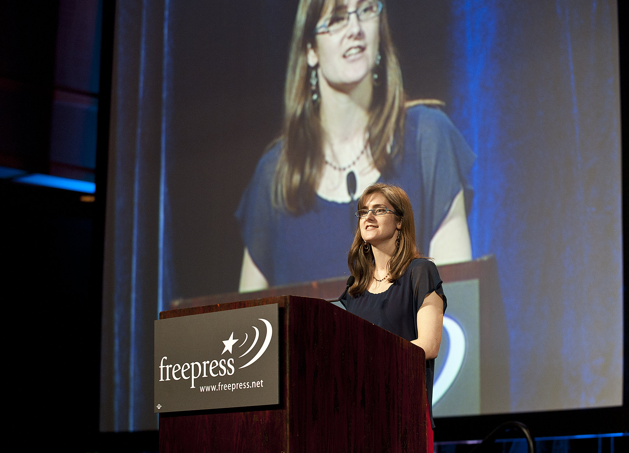 Mary Alice Crim speaking at a podium at the National Conference for Media Reform