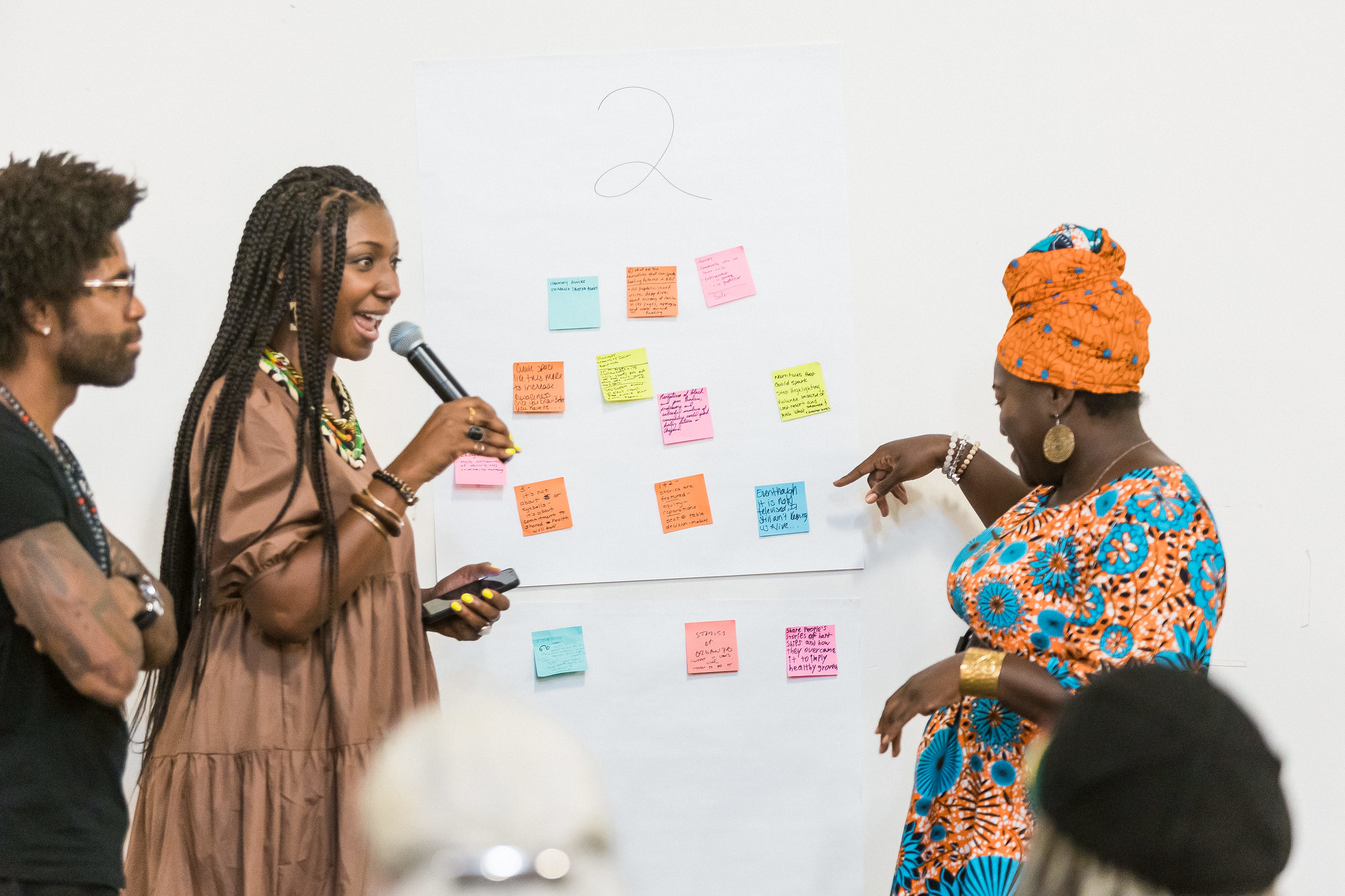 Facilitators read some of the thoughts shared on the response wall following the Black in the Newsroom screening