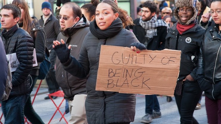 Black Lives Matter activists with the sign "Guilty of being black"