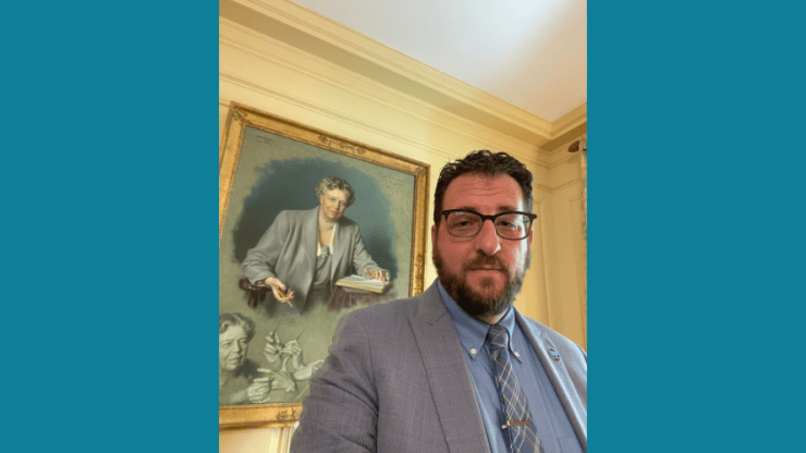 Free Press Co-CEO Craig Aaron in front of the Eleanor Roosevelt portrait at the White House
