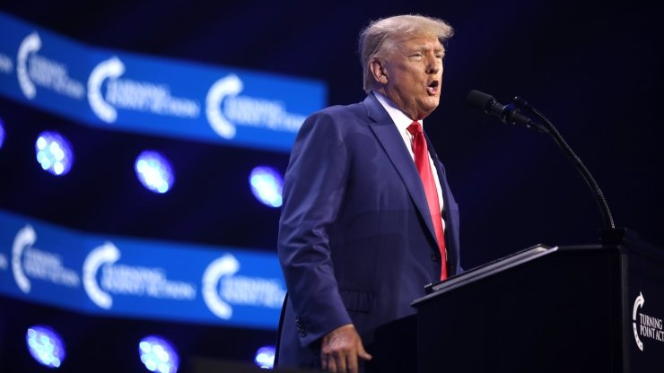 Trump giving a speech at the 2023 Turning Point Action Conference