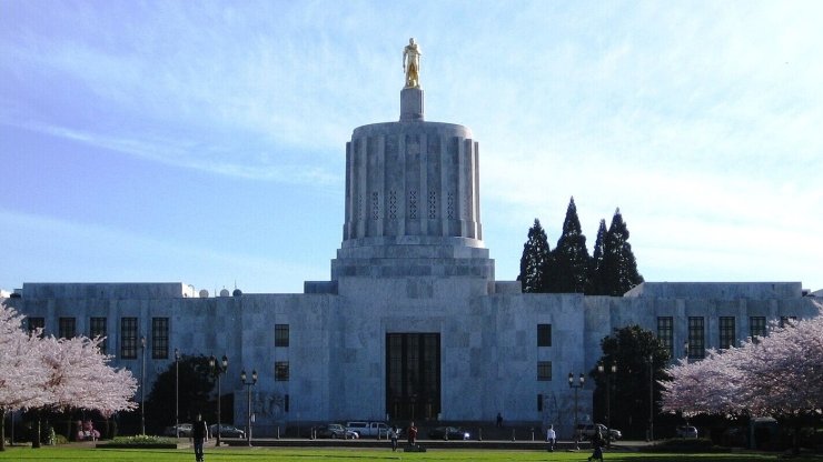 The exterior of the Oregon Statehouse on a spring day