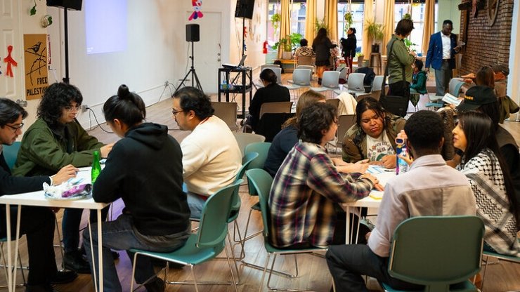 Residents of Chicago's Pilsen neighborhood discussing local news