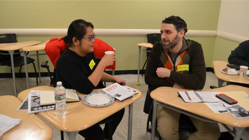 Woman and man talking during 37 Voices workshop