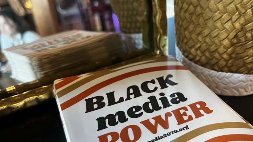 A stack of "Black Media Power" booklets at the Black Future Newsstand exhibit at AfroTech