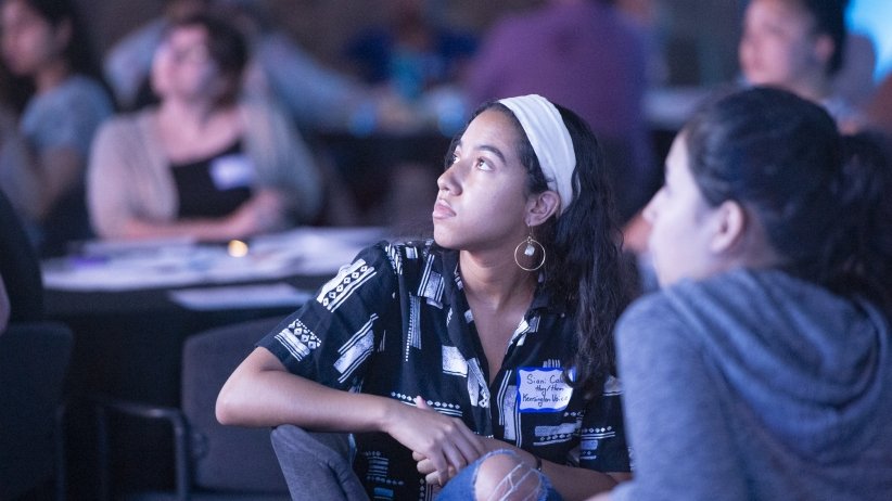 A woman listening during the event.