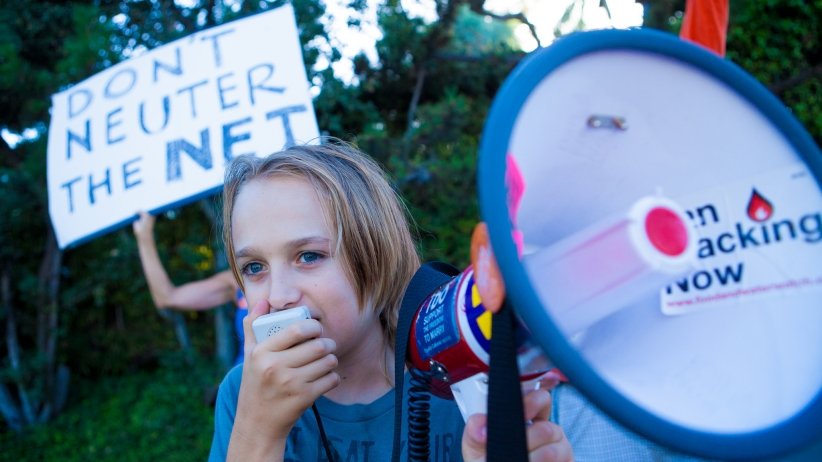 Young boy talking into megaphone