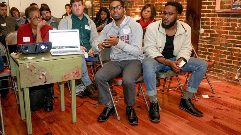 People sitting in rows of chairs