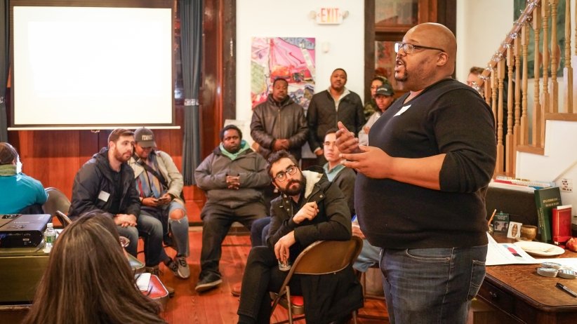Free Press Action Organizer James Thompson talking to the group