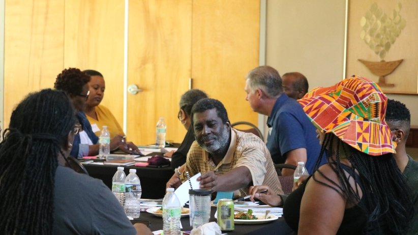 Participants seated around a table