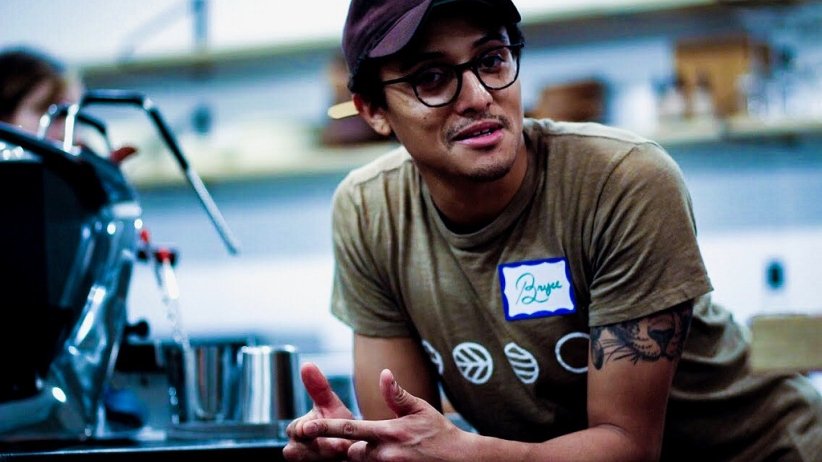 Participant in Charlotte conversation leaning forward and listening