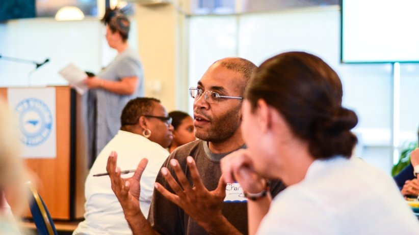 A man gestures as he speaks