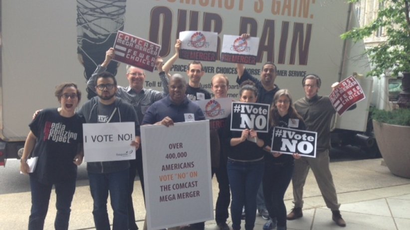 Activists holding signs saying "I vote no!"