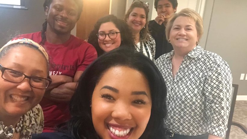 Up-close photo of participants smiling