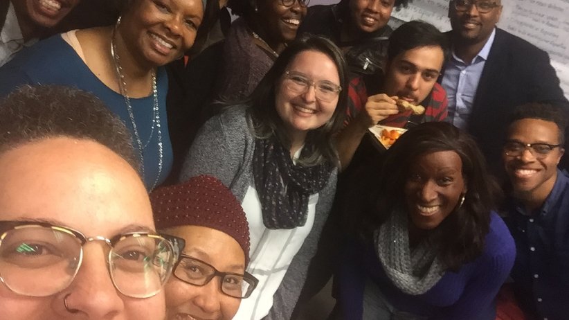 Up-close photo of library-series participants smiling for the camera