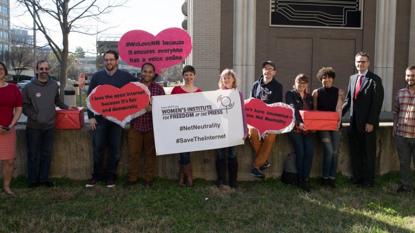 Staffers from Free Press Action and other groups holding valentines to Net Neutrality