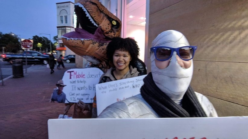 Activists dressed as Godzilla, a ghostbuster and a zombie