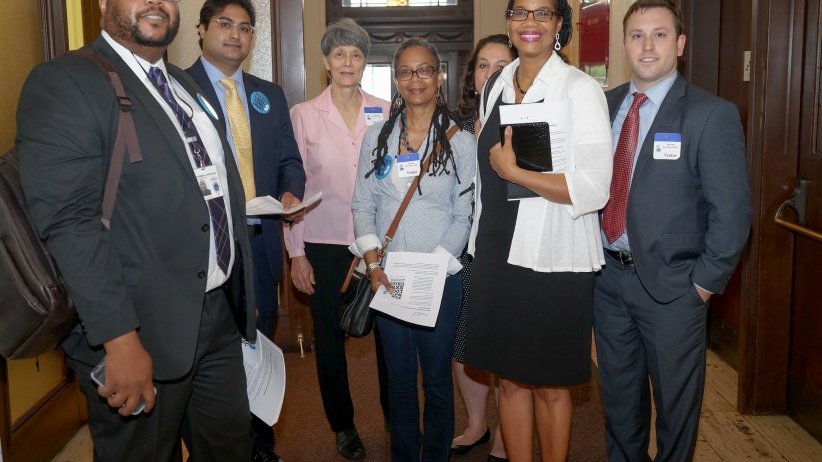 Group of people standing by doorway