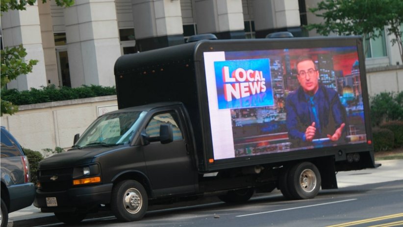 Video billboard displaying John Oliver's anti-Sinclair segment