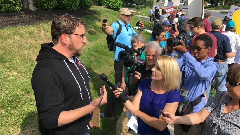 Reporters interviewing Free Press Action Fund President and CEO Craig Aaron