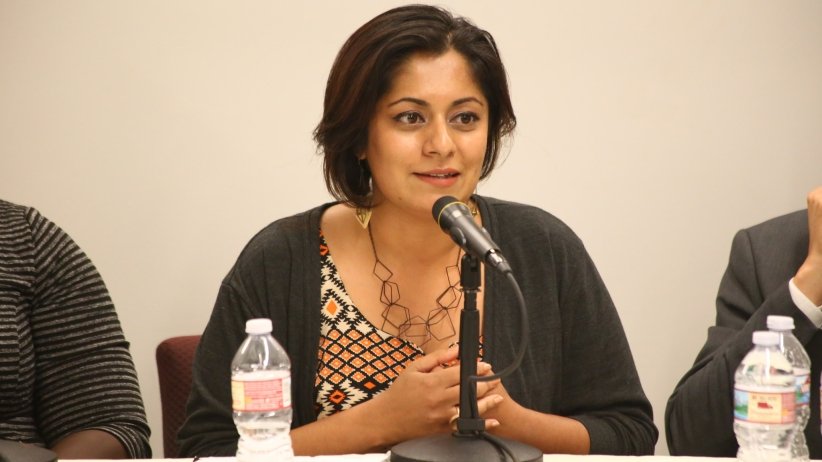 Woman talking into microphone