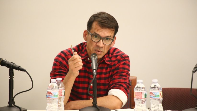 Man talking into microphone