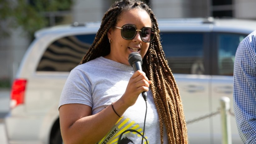 Woman speaking into microphone