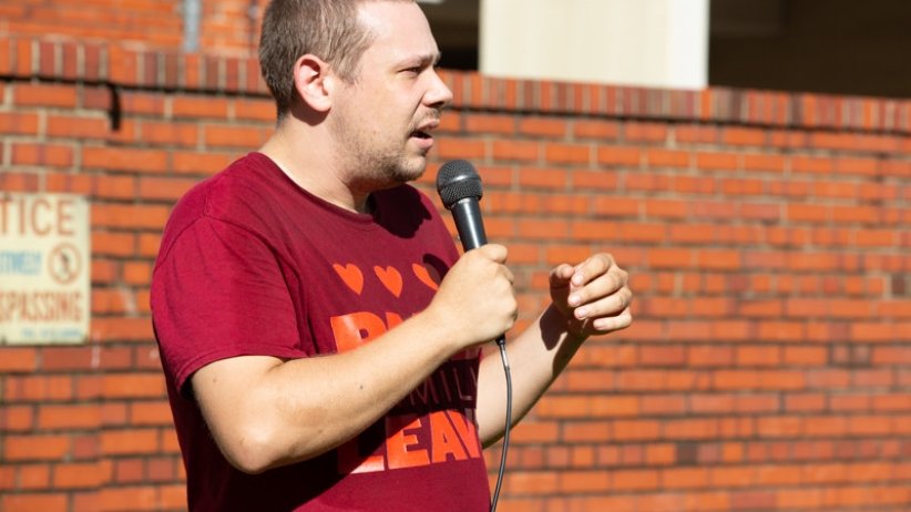 Brandon Forester holding microphone