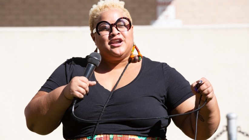 Woman speaking into microphone