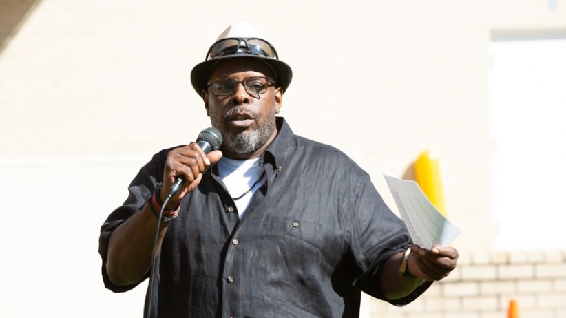 Man speaking into microphone