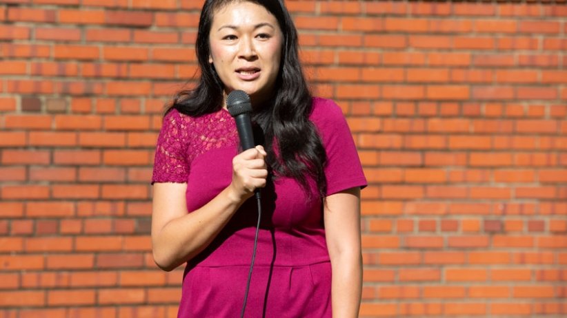 Woman speaking into microphone
