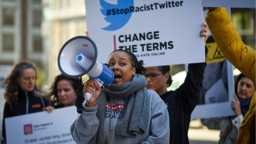 MediaJustice National Field Organizer Erin Shields speaking into a bullhorn