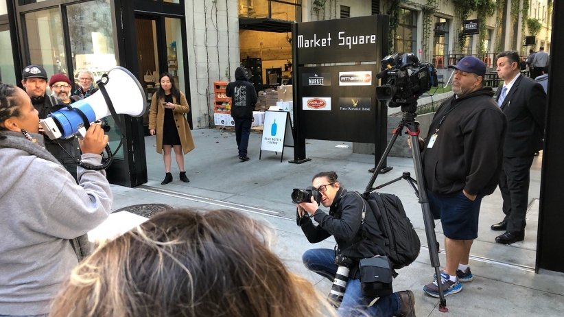 Press taking photos of activists