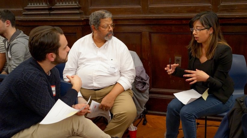 Three people talking