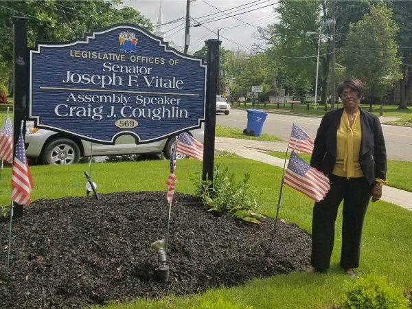 Woman outside the office of Sen. Joseph F. Vitale and Assembly Speaker Craig J. Couglin in NJ