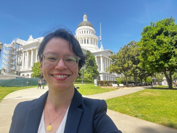 Free Press Action's Qing Saville outside the California statehouse