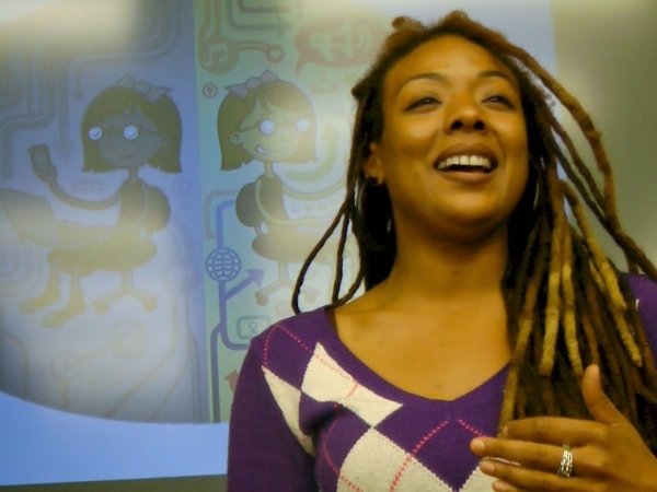 Woman in purple shirt smiling