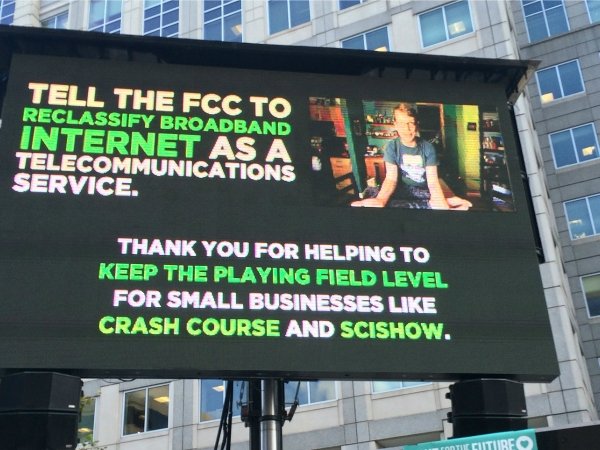 Billboard urging the FCC to "reclassify broadband internet as a telecommunications service"
