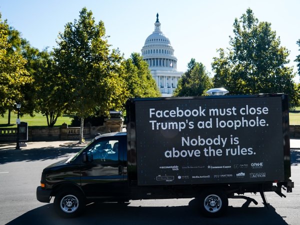 Mobile billboard reading "Facebook must close Trump's ad loophole. Nobody is above the rules."