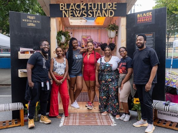 Media 2070 staff members and allies at the Black Future Newsstand installation in Harlem