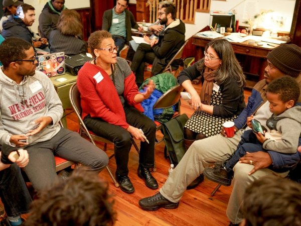 Group of people talking in a circle