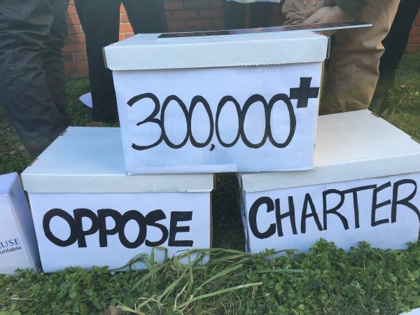 Three stacked boxes reading "300,000+ oppose Charter"