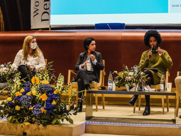 Five panelists on stage at the World Forum for Democracy
