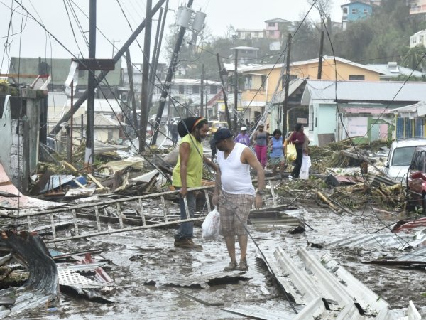 Residents standing amid the devastation in Puerto Rico