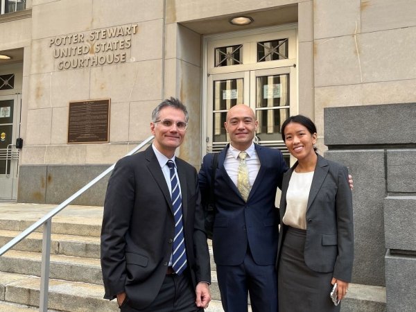 Free Press’ Matt Wood and Yanni Chen flank Daniel Woofter, the attorney representing Free Press and allies in the court case 