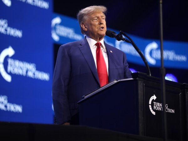 Trump giving a speech at the 2023 Turning Point Action Conference
