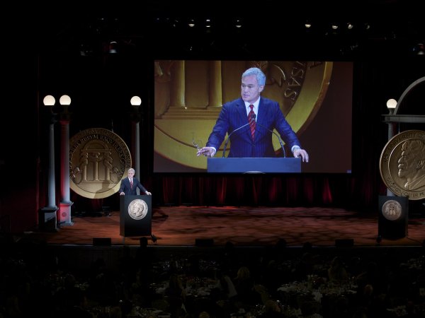 Scott Pelley receiving a Peabody Award
